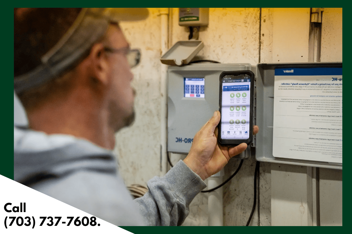 Technician using smartphone to check electrical panel